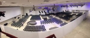 comparativo de custos logística de eventos Bahia vs equipe de fora Sanches Produções